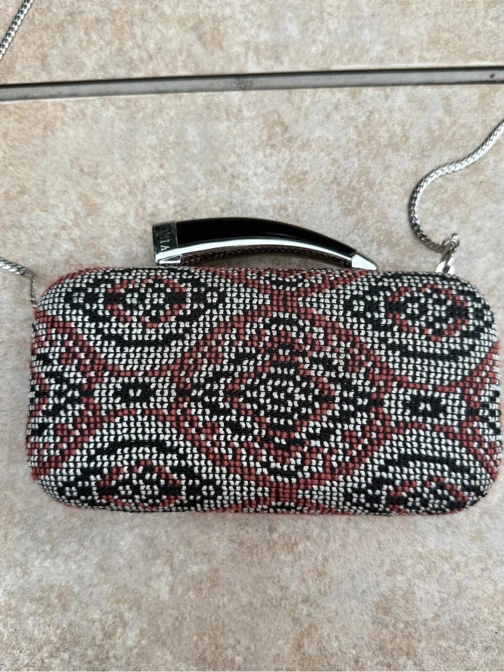 Vince Camuto textured clutch bag with a crossbody chain
